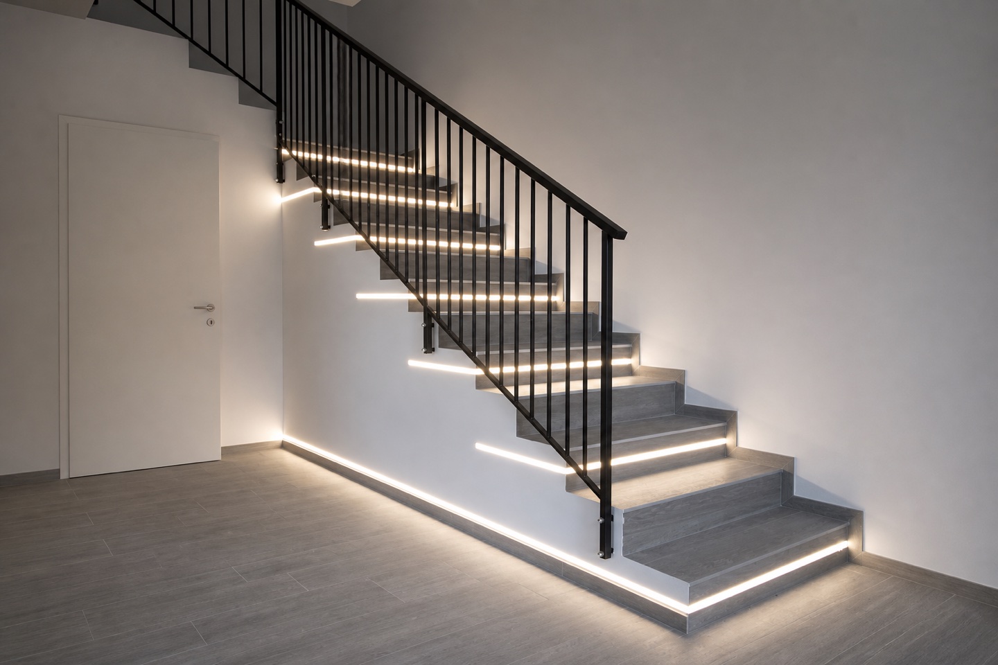 Ricostruzione visiva della stessa scala completata, con finitura grigia e illuminazione integrata